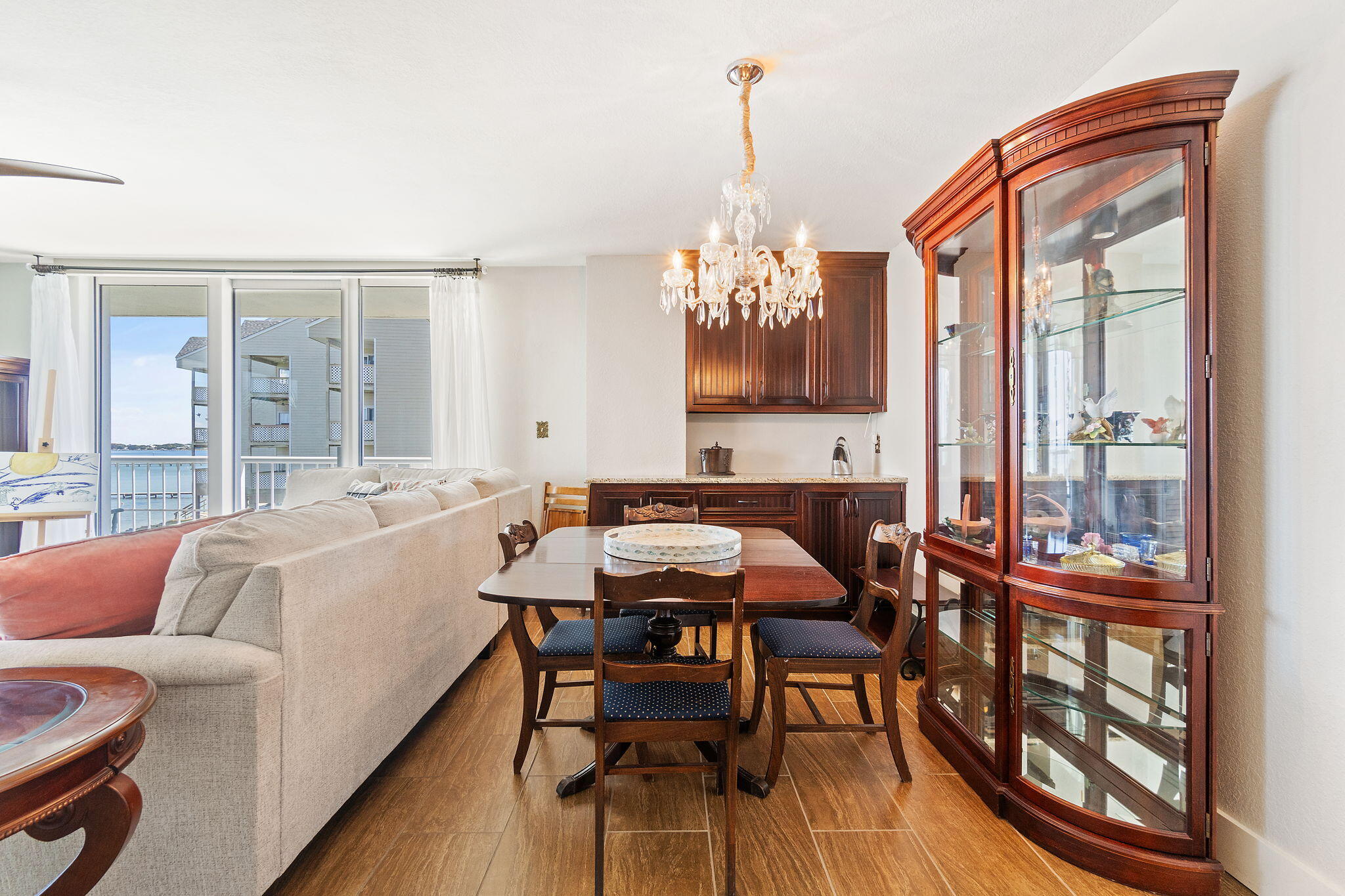 1200 Fort Pickens Road, Unit 1E Pensacola Beach, FL 32561 - Photo 15 of 44 a living room with furniture and a chandelier