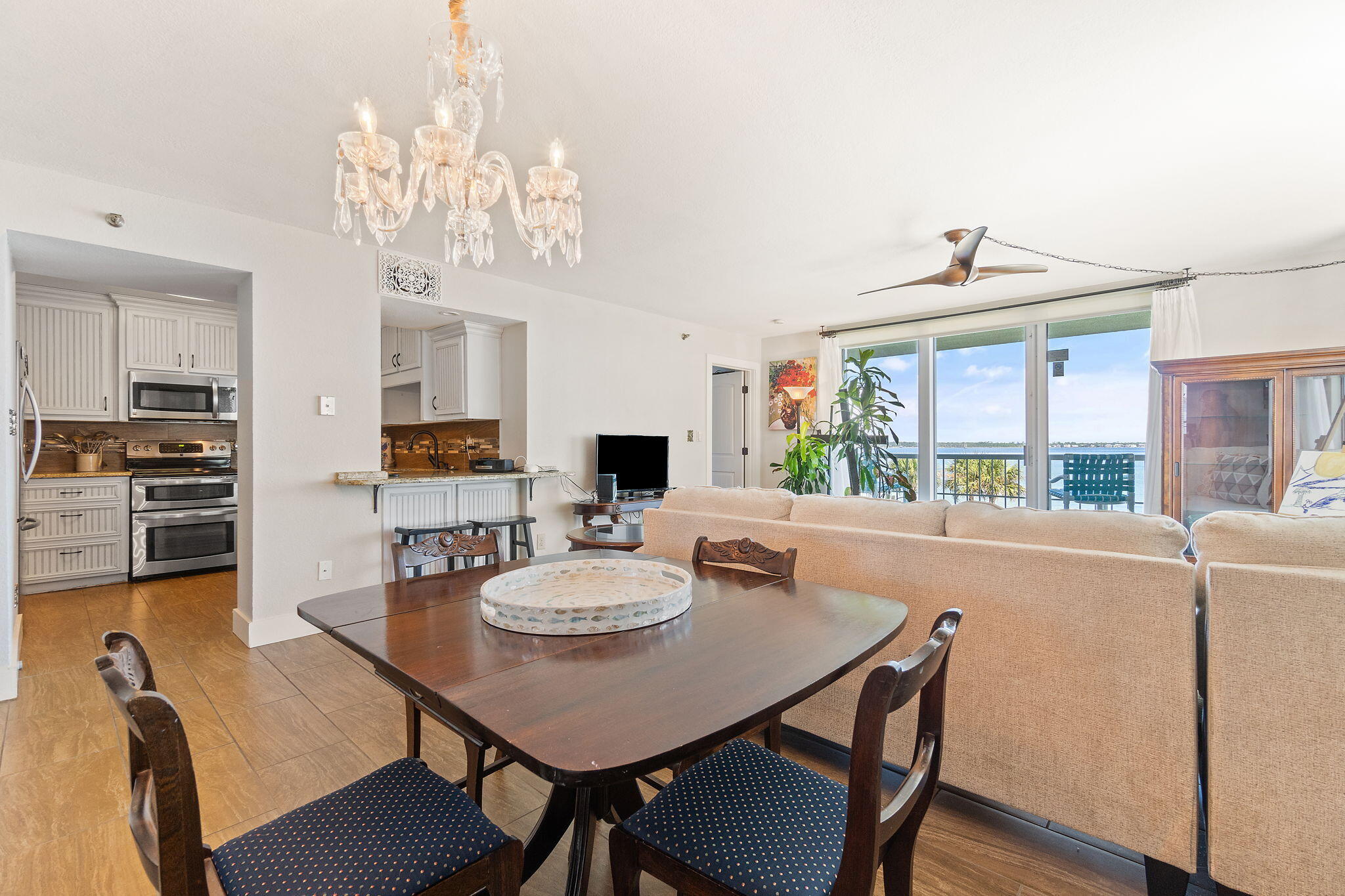 1200 Fort Pickens Road, Unit 1E Pensacola Beach, FL 32561 - Photo 16 of 44 a view of a dining room with furniture window and wooden floor