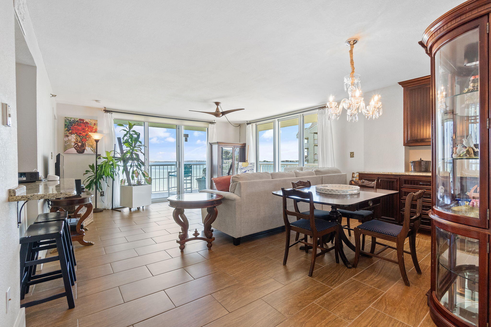 1200 Fort Pickens Road, Unit 1E Pensacola Beach, FL 32561 - Photo 2 of 44 a view of a dining room with furniture and chandelier
