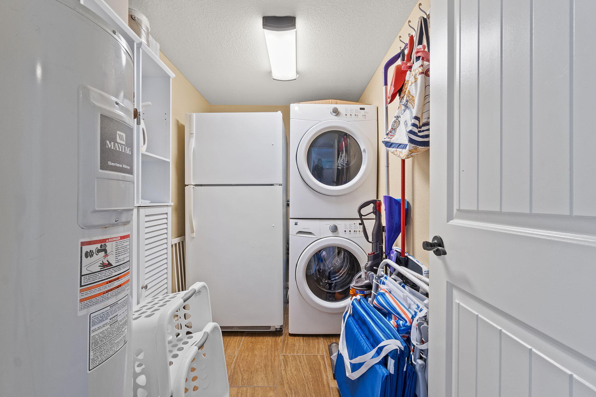 1200 Fort Pickens Road, Unit 1E Pensacola Beach, FL 32561 - Photo 21 of 44 a utility room with dryer and washer