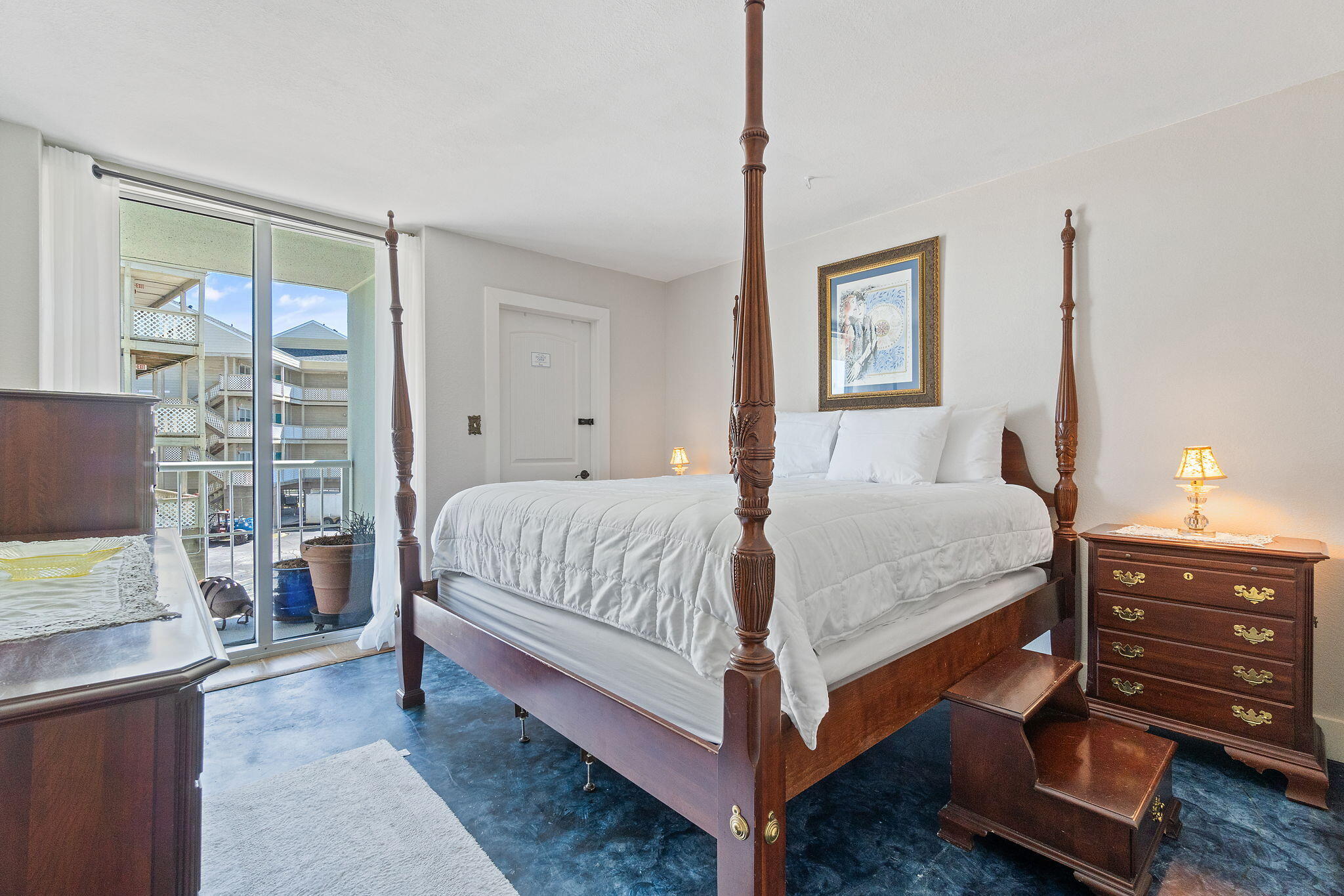 1200 Fort Pickens Road, Unit 1E Pensacola Beach, FL 32561 - Photo 23 of 44 a bed sitting in a bedroom next to a window