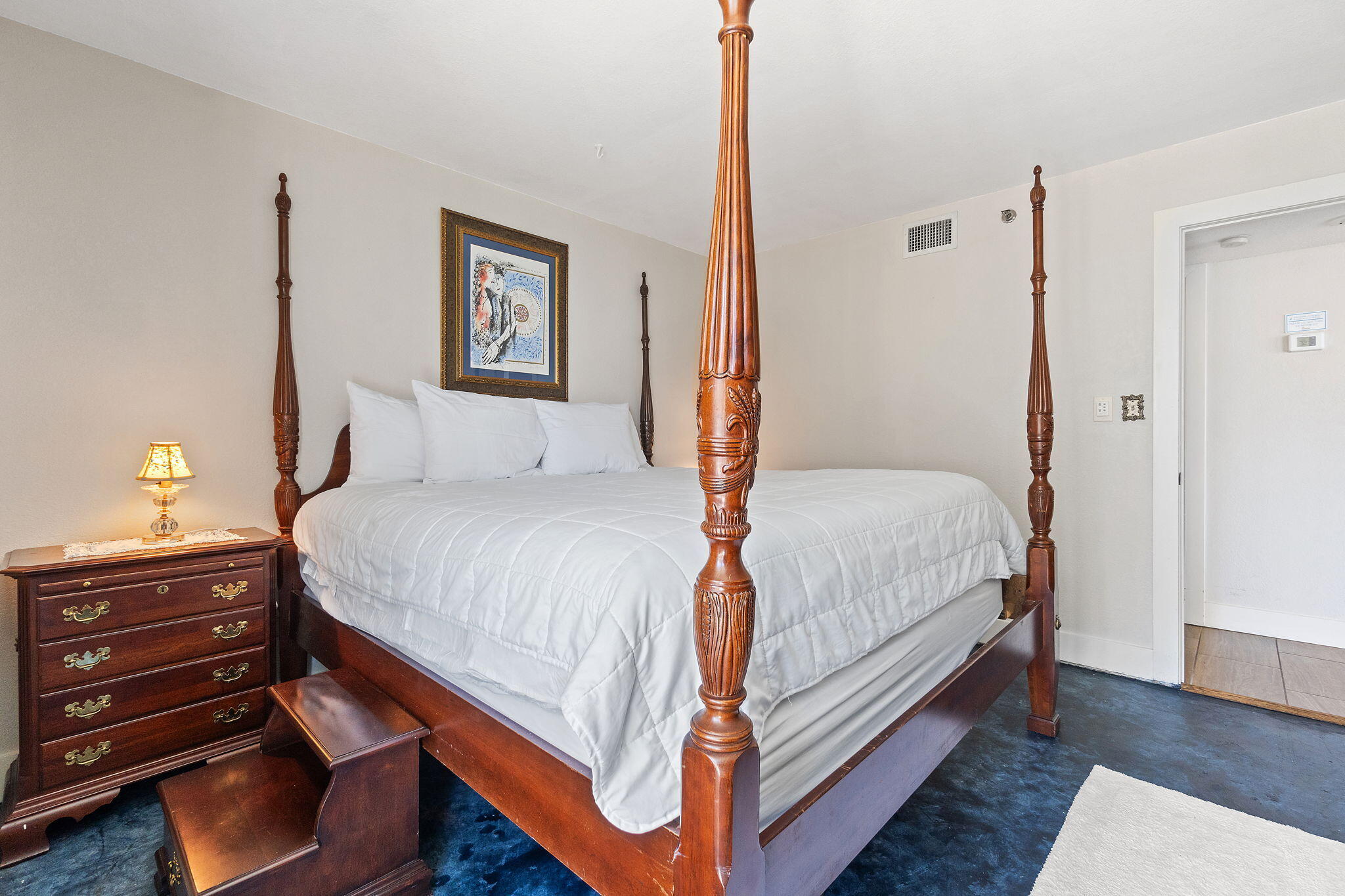 1200 Fort Pickens Road, Unit 1E Pensacola Beach, FL 32561 - Photo 24 of 44 a bedroom with a bed and a night stand