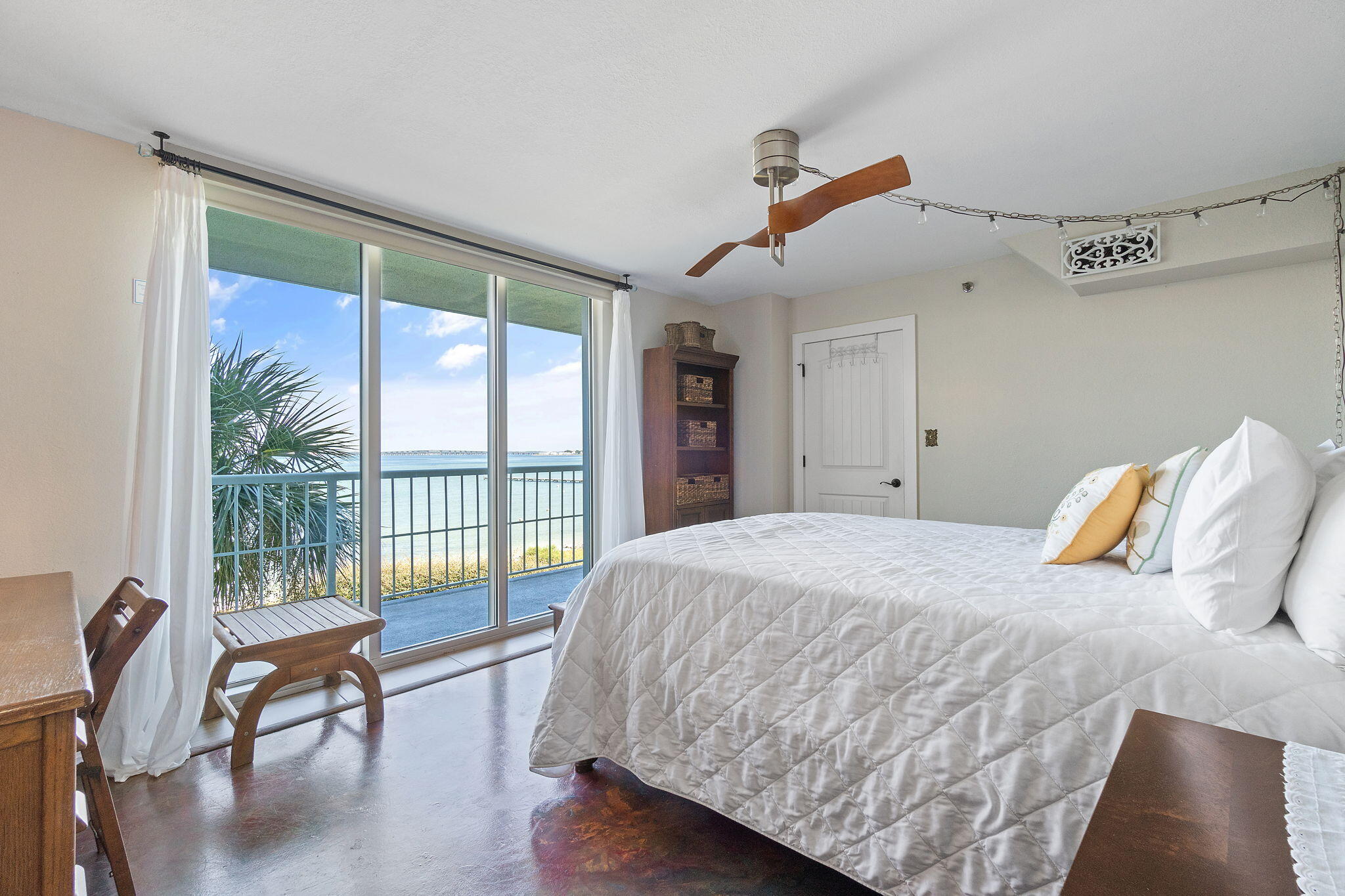1200 Fort Pickens Road, Unit 1E Pensacola Beach, FL 32561 - Photo 27 of 44 a bedroom with a bed and a large window