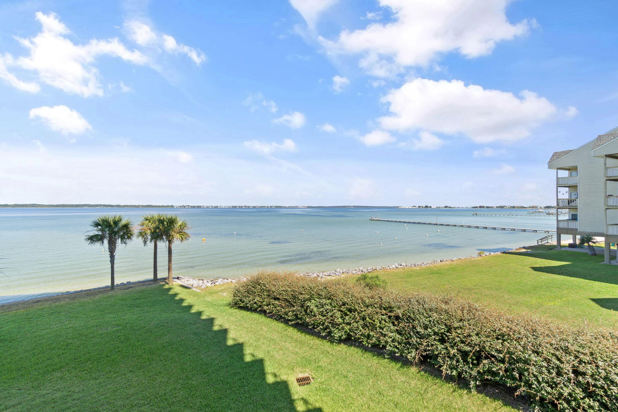 1200 Fort Pickens Road, Unit 1E Pensacola Beach, FL 32561 - Photo 3 of 44 a view of a lake with a big yard