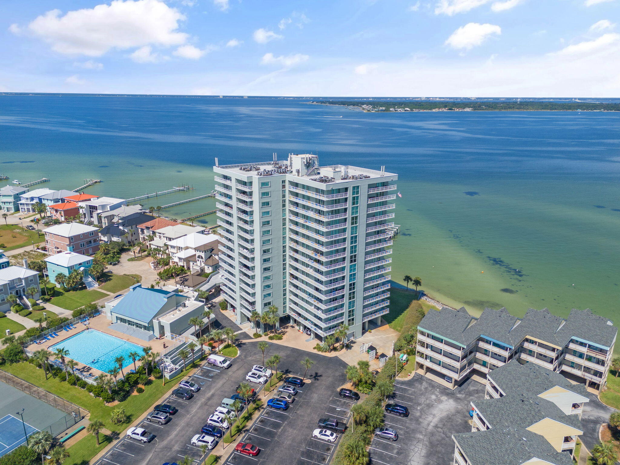 1200 Fort Pickens Road, Unit 1E Pensacola Beach, FL 32561 - Photo 37 of 44 a view of a patio with table and chairs and potted plants