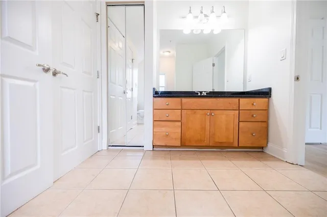 a bathroom with a toilet and a shower curtain