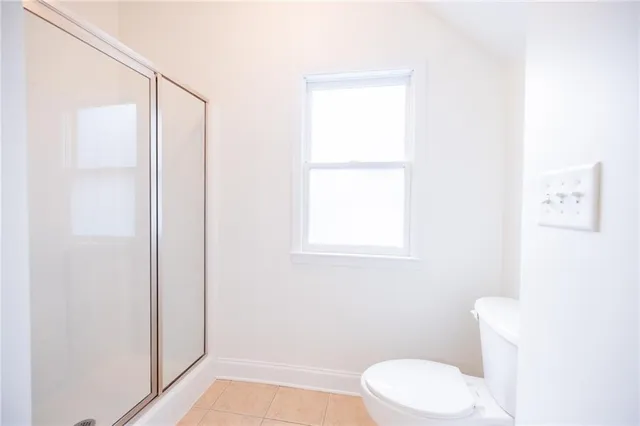 a bathroom with a granite countertop sink mirror and a bathtub