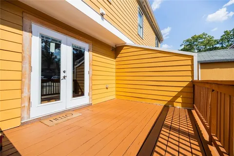 a view of balcony with wooden floor