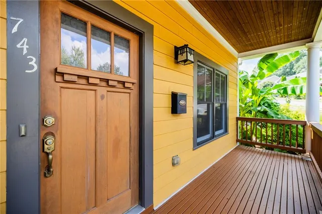 a view of a brick house with a large window