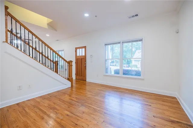 a view of an entryway with wooden floor