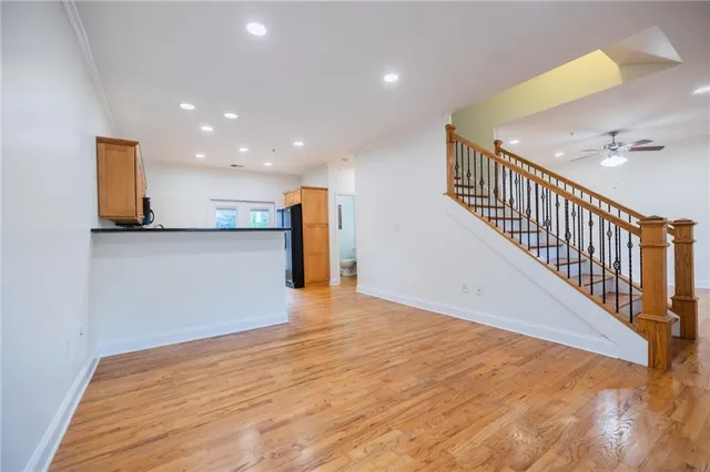 a view of a hallway with wooden floor