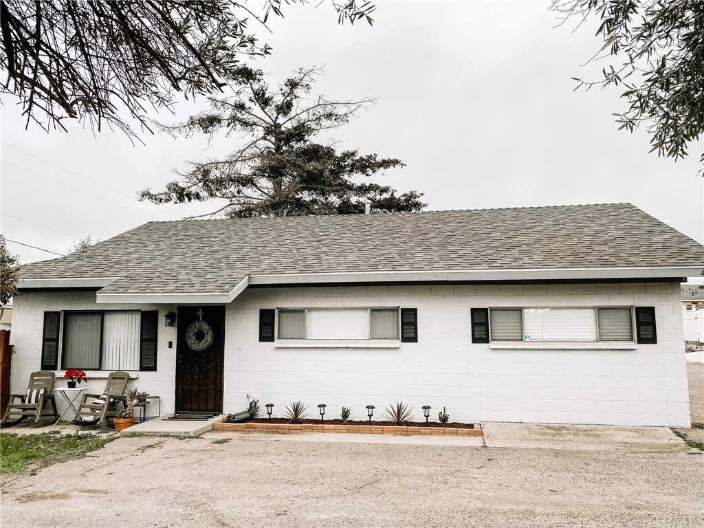 4126 Orcutt Road Santa Maria, CA 93455 - Photo 1 of 1 a front view of a house with a tree