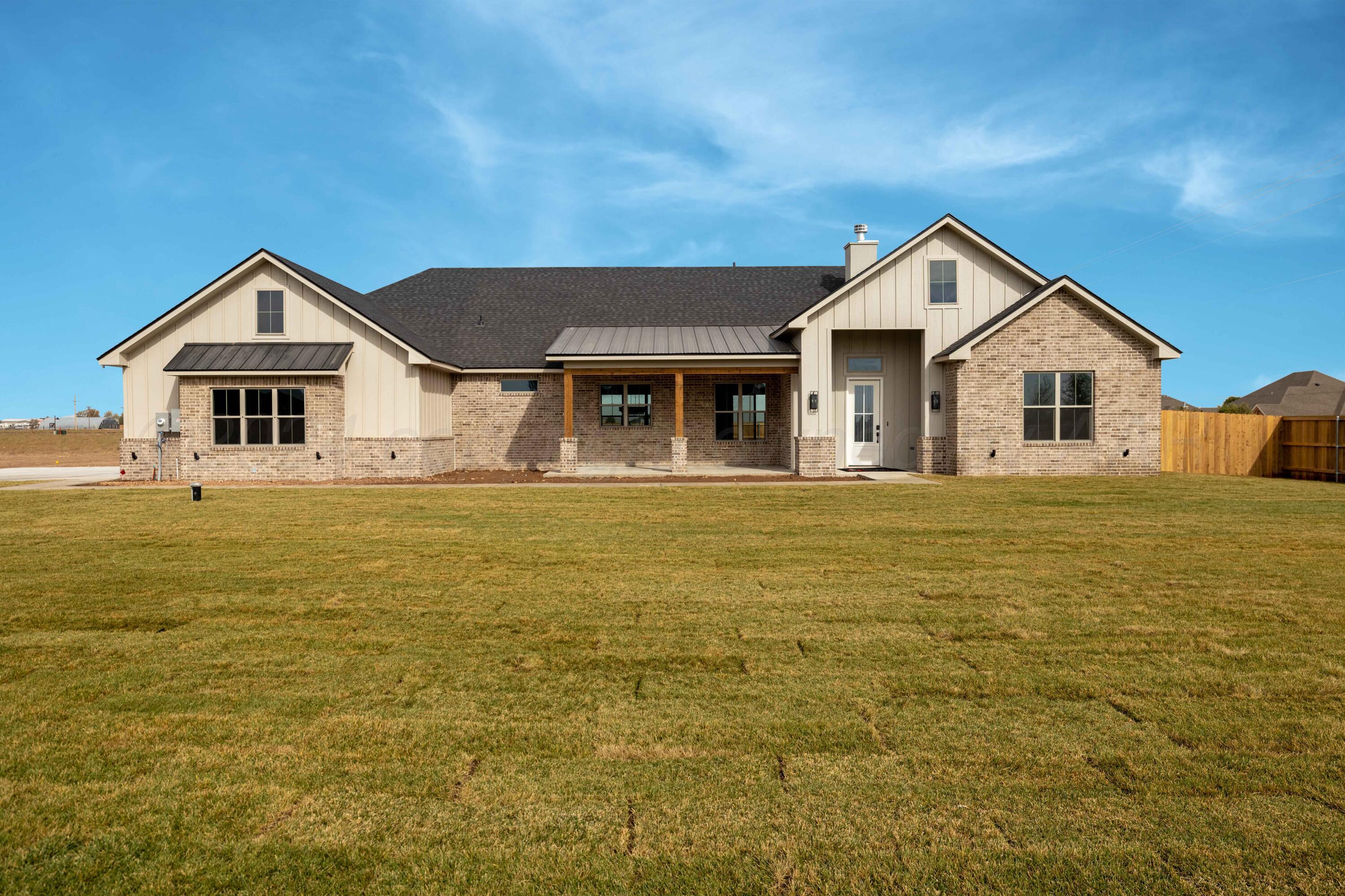 10150 Cactus Flower Road Amarillo, TX 79119 - Photo 2 of 47 a front view of a house with a yard
