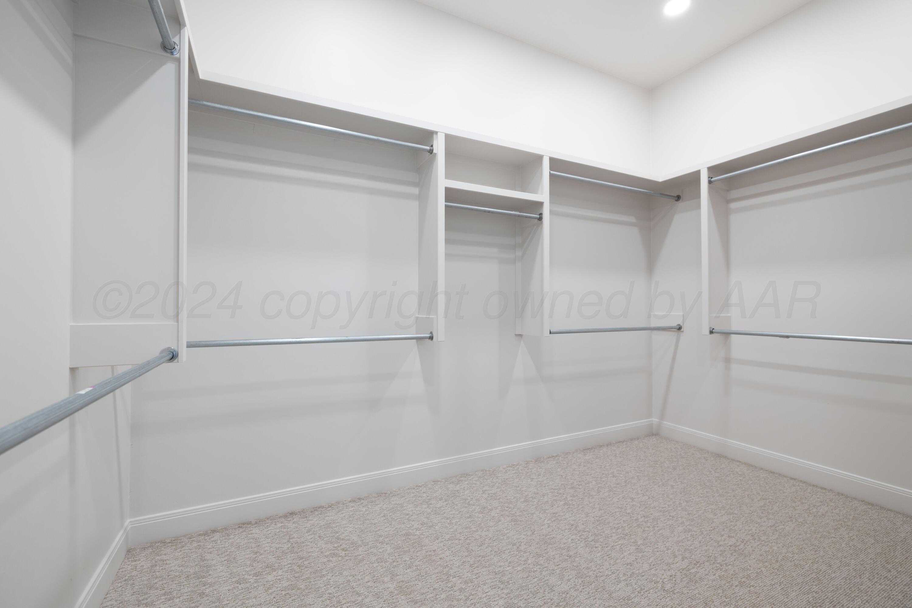 10150 Cactus Flower Road Amarillo, TX 79119 - Photo 30 of 47 a view of an empty walk in closet