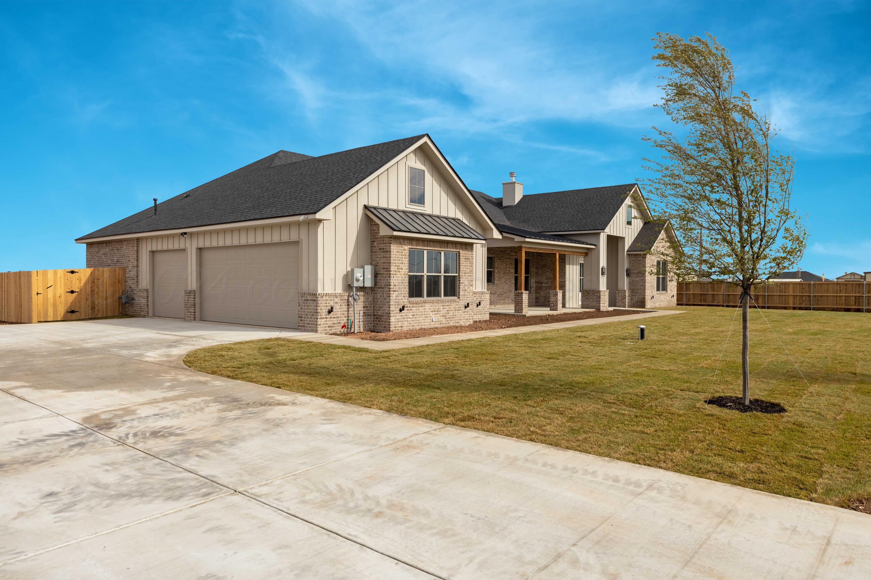 10150 Cactus Flower Road Amarillo, TX 79119 - Photo 3 of 47 a front view of a house with a yard
