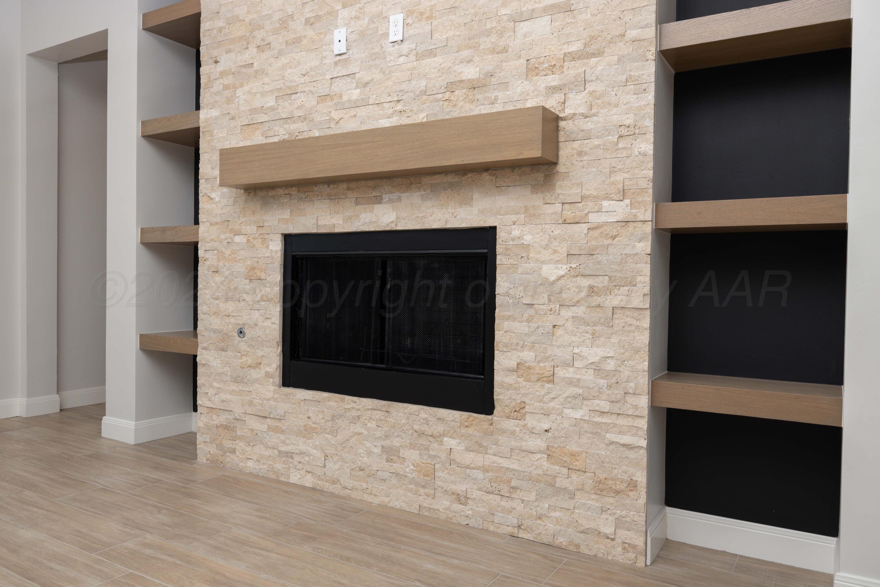 10150 Cactus Flower Road Amarillo, TX 79119 - Photo 6 of 47 a view of an empty room with a fireplace