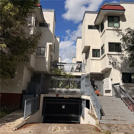 a front view of a house with open kitchen