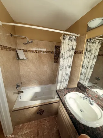 a bathroom with a sink and shower