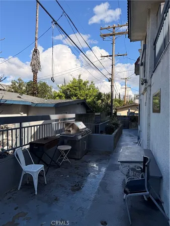a view of a chairs and table in the patio