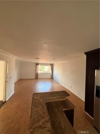 a view of a living room and bedroom