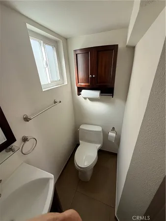 a bathroom with a toilet and a sink