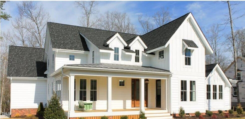 431 Fieldstone Lane Chapel Hill, NC 27516 - Photo 1 of 5 a view of a white house with large windows