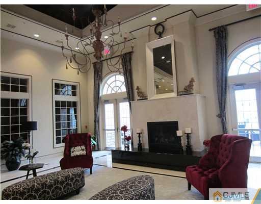 12 Hartack Road Manalapan, NJ 07726 - Photo 23 of 23 a living room with furniture and a fireplace