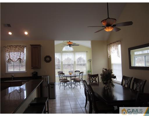 12 Hartack Road Manalapan, NJ 07726 - Photo 4 of 23 a view of a dining room with furniture window and outside view