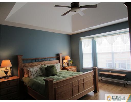 12 Hartack Road Manalapan, NJ 07726 - Photo 5 of 23 a bedroom with furniture and a window