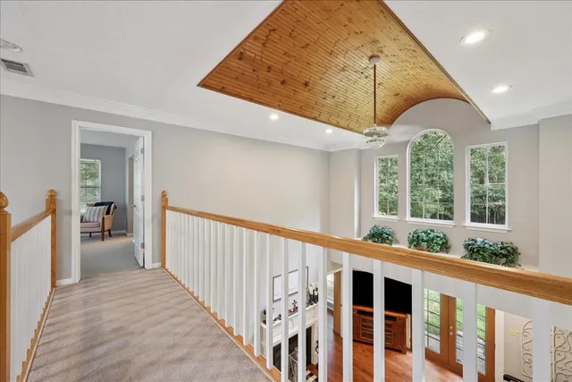 a view of a hallway with windows