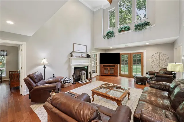 a living room with furniture fireplace and flat screen tv