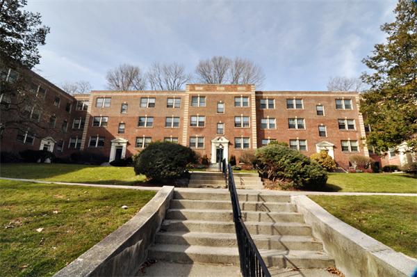 1498 Beacon Street, Unit 4 Brookline, MA 02446 - Photo 1 of 8 a view of building with yard