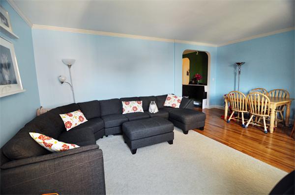 1498 Beacon Street, Unit 4 Brookline, MA 02446 - Photo 3 of 8 a living room with furniture and wooden floor