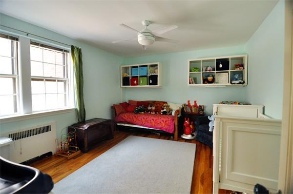 1498 Beacon Street, Unit 4 Brookline, MA 02446 - Photo 5 of 8 a living room with furniture and a window