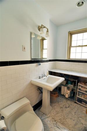 1498 Beacon Street, Unit 4 Brookline, MA 02446 - Photo 6 of 8 a bathroom with a sink toilet and mirror