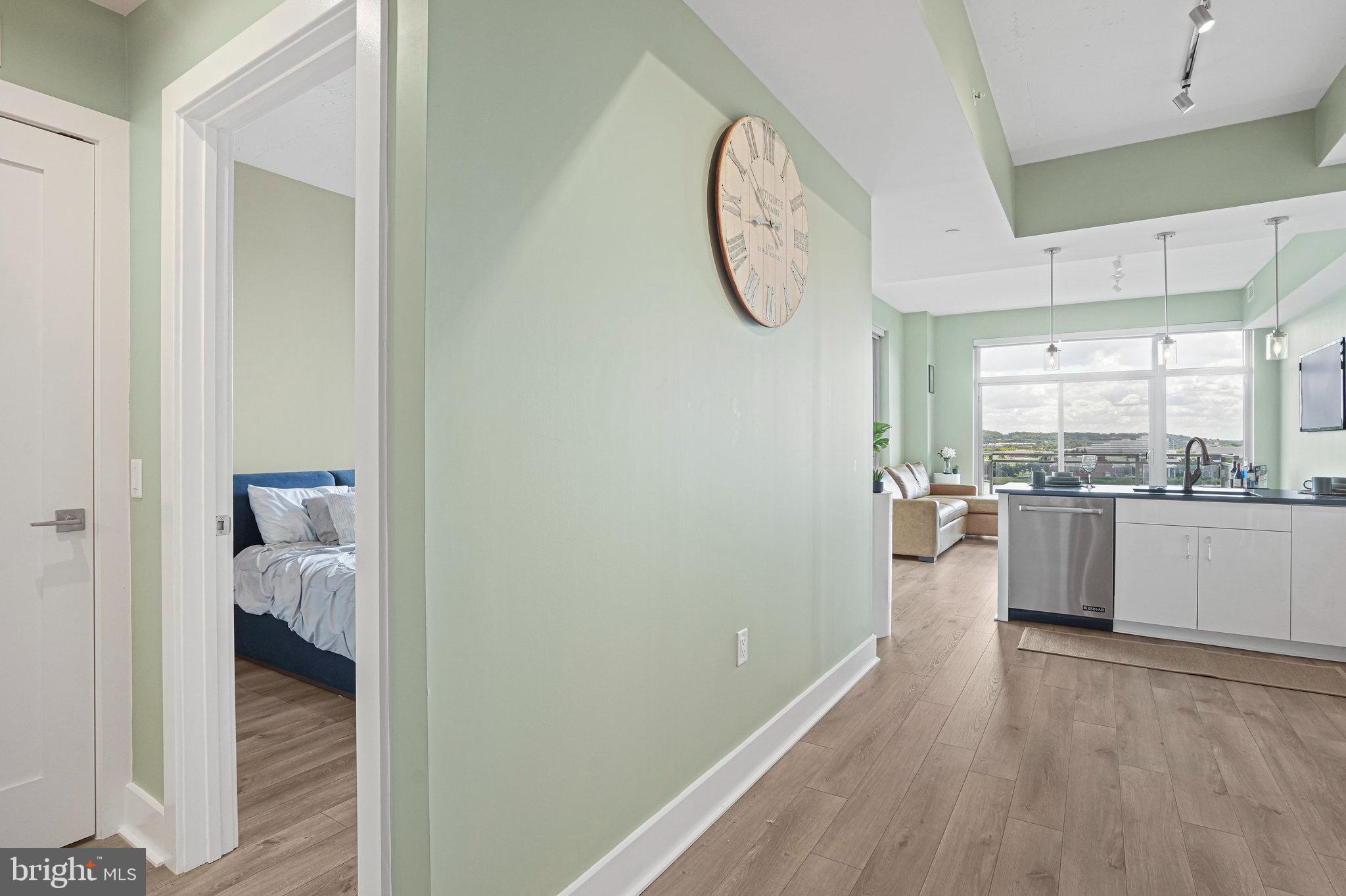 88 V Street Southwest, Unit 807 Washington, DC 20024 - Photo 11 of 57 a view of a kitchen from the hallway