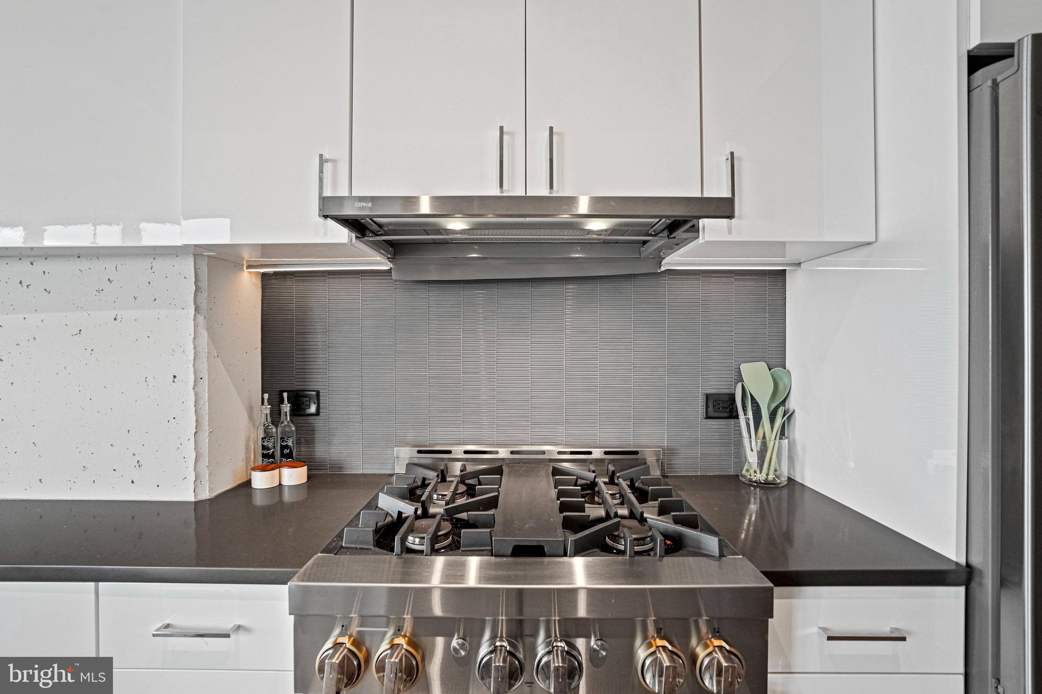 88 V Street Southwest, Unit 807 Washington, DC 20024 - Photo 18 of 57 a kitchen with a stove and a sink