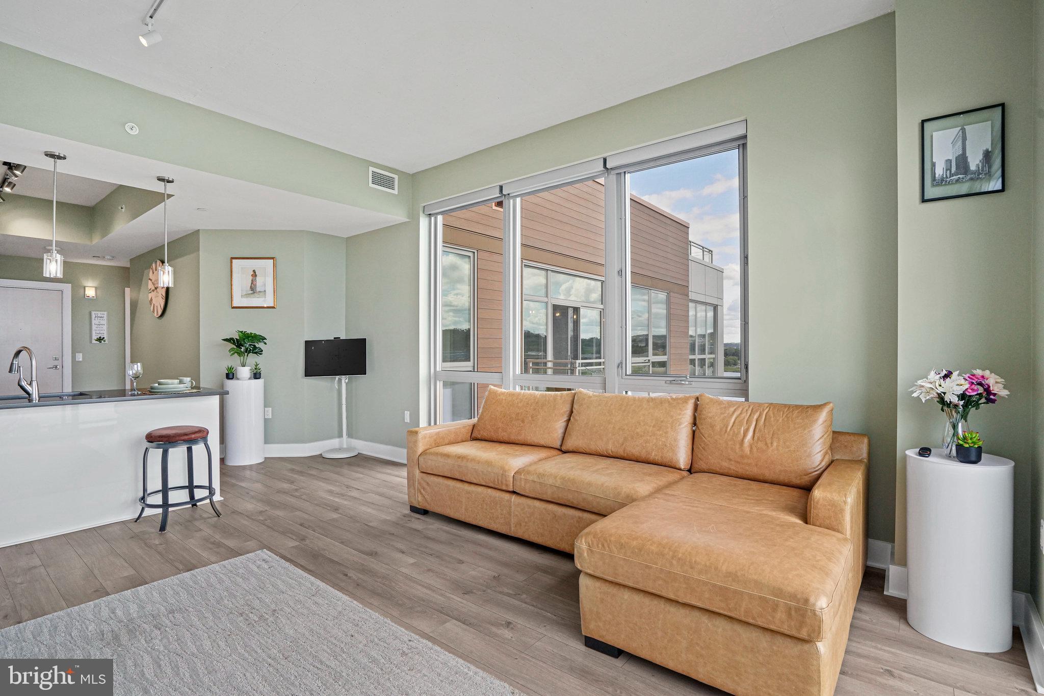 88 V Street Southwest, Unit 807 Washington, DC 20024 - Photo 20 of 57 a living room with furniture and a large window