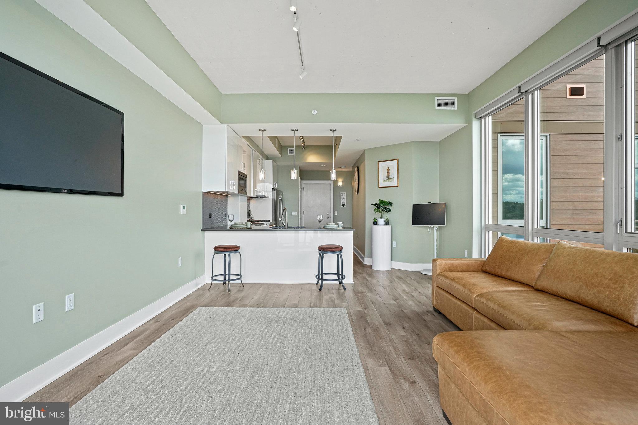 88 V Street Southwest, Unit 807 Washington, DC 20024 - Photo 21 of 57 a living room with furniture and a large window