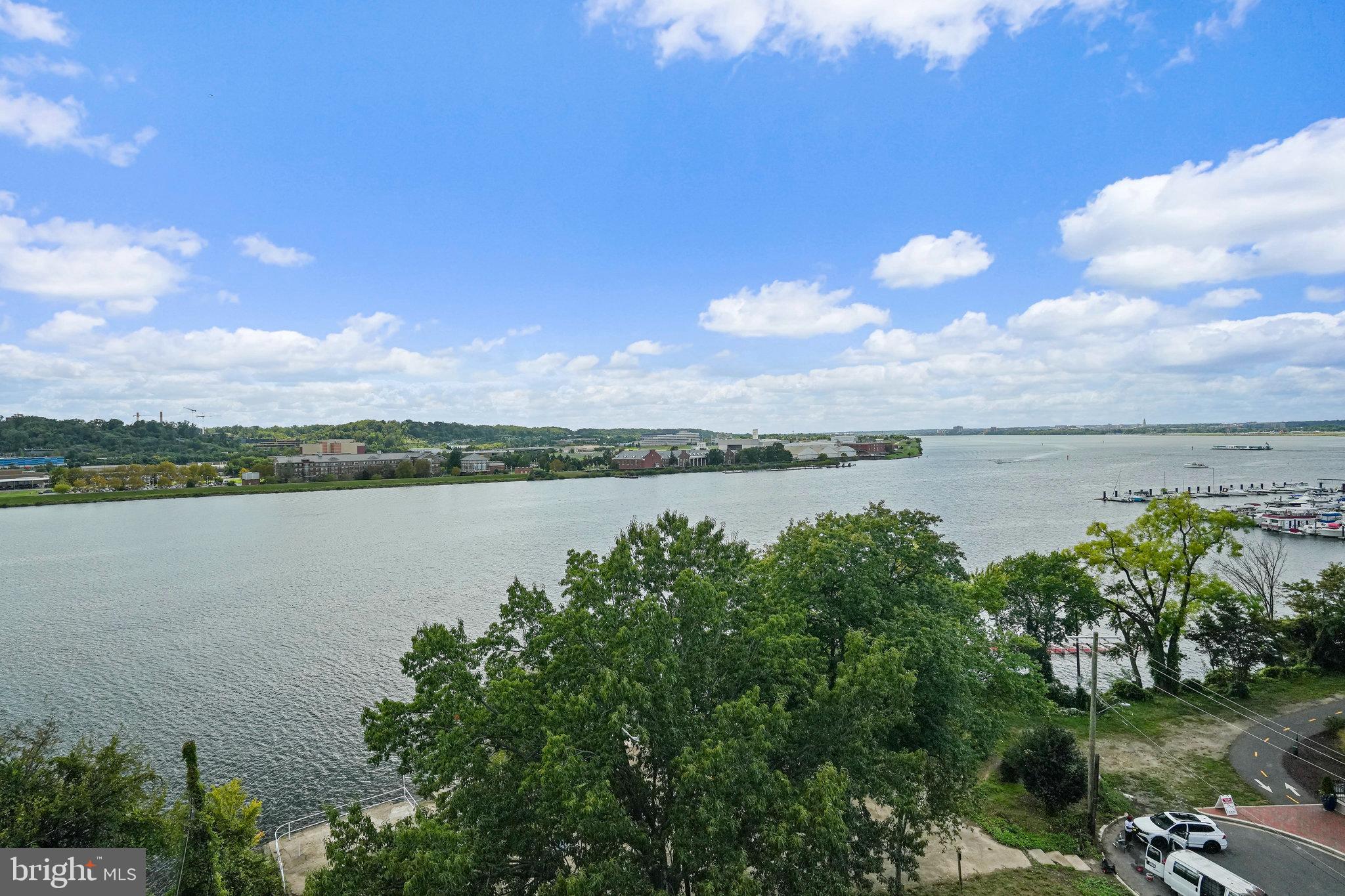 88 V Street Southwest, Unit 807 Washington, DC 20024 - Photo 23 of 57 a view of a lake with houses in the back