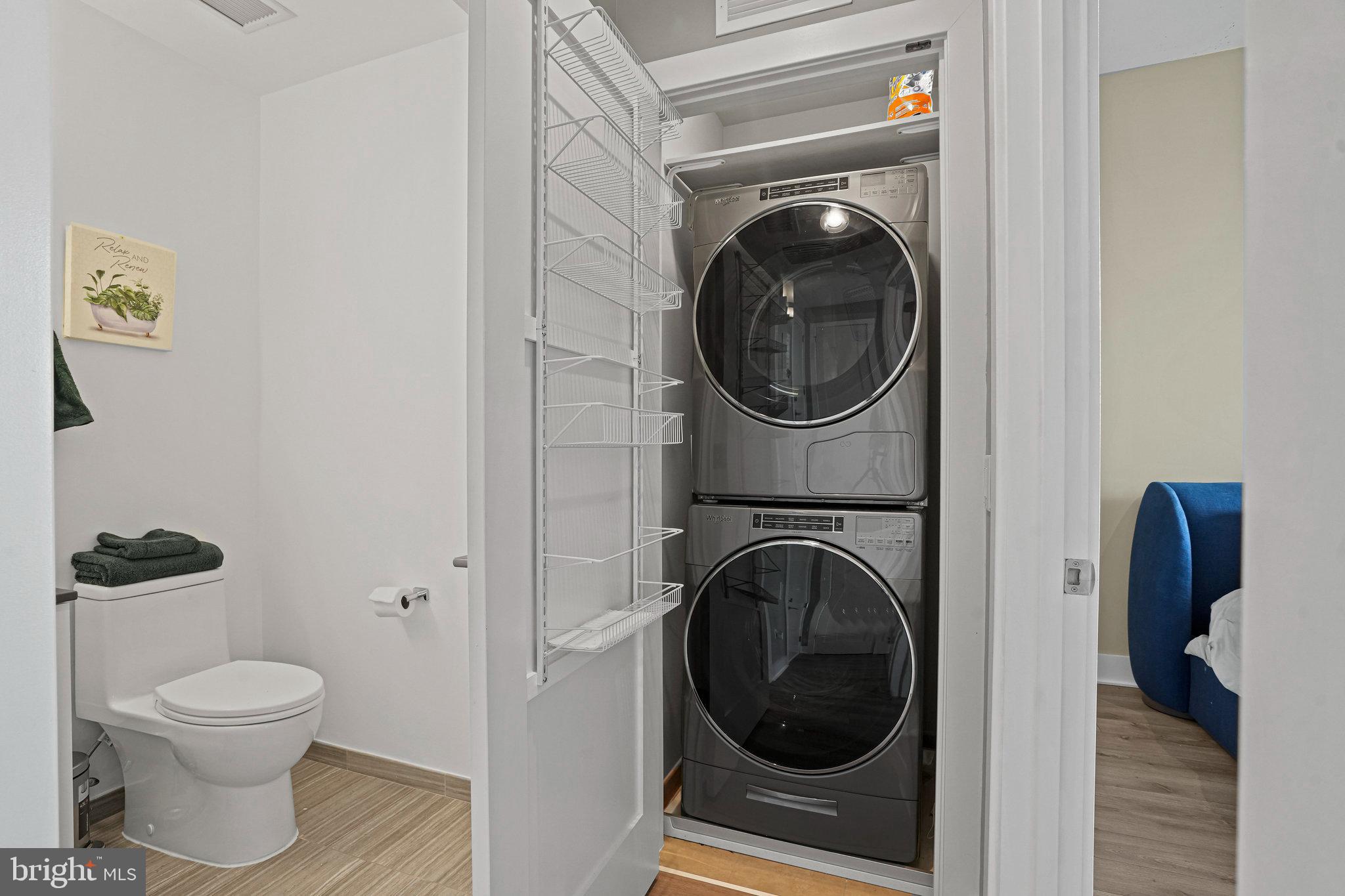 88 V Street Southwest, Unit 807 Washington, DC 20024 - Photo 32 of 57 a view of a bathroom with a washer and dryer