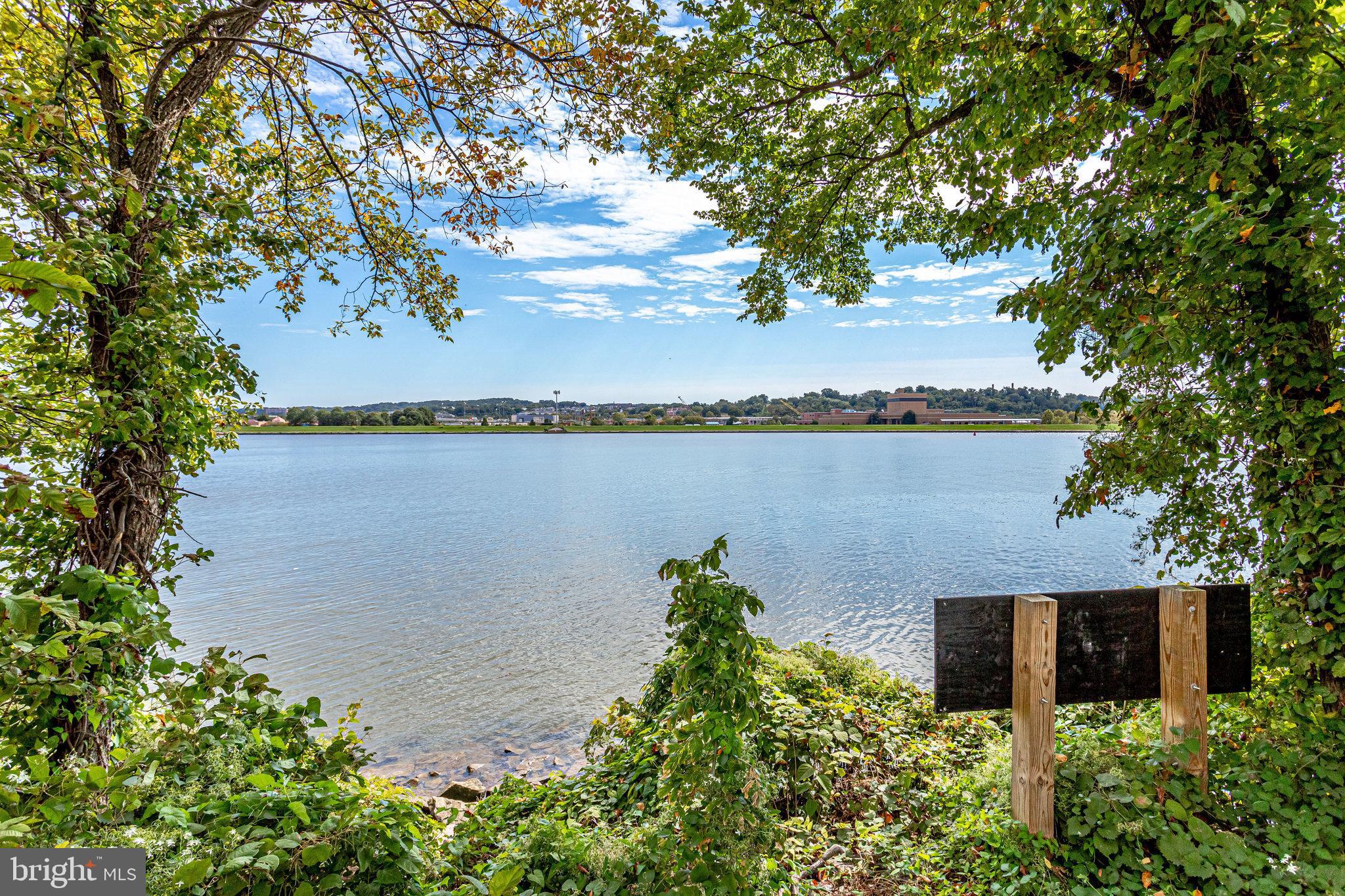 88 V Street Southwest, Unit 807 Washington, DC 20024 - Photo 48 of 57 a view of a lake with houses in the back