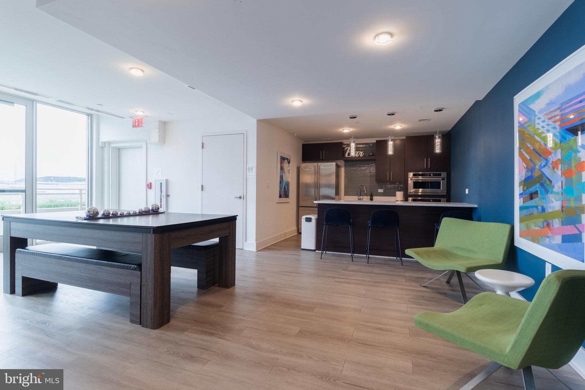 88 V Street Southwest, Unit 807 Washington, DC 20024 - Photo 53 of 57 a view of kitchen with dining room and wooden floor