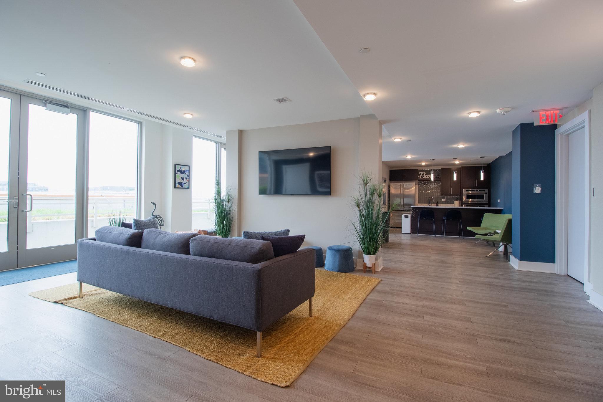 88 V Street Southwest, Unit 807 Washington, DC 20024 - Photo 10 of 57 a living room with furniture and a flat screen tv