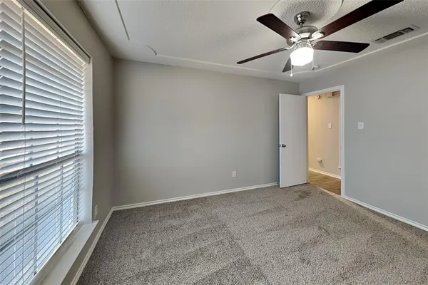 a view of an empty room with a window