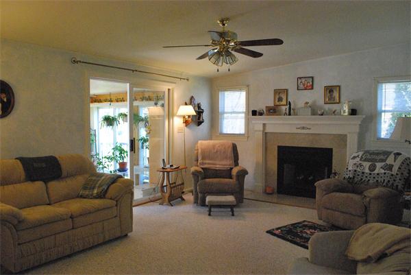 6 Robbins Road Ayer, MA 01432 - Photo 6 of 19 a living room with furniture and a fireplace