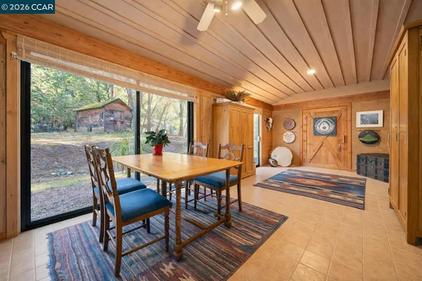 a view of a dining room with furniture window and outside view