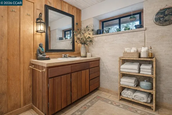 a bathroom with a sink double vanity and a mirror