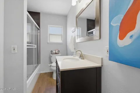 a bedroom with furniture and a window