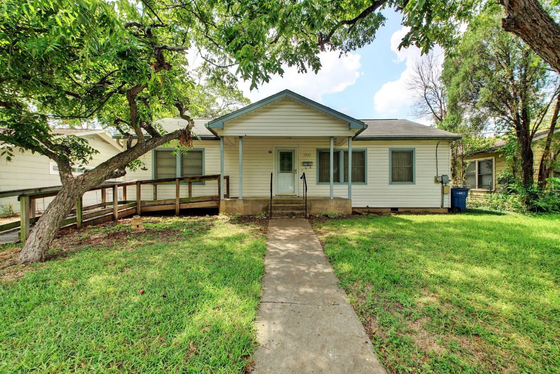 1207 Ruth Avenue Austin, TX 78757 - Photo 1 of 1 a front view of a house with yard and green space